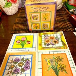 SET OF 4..”COUNTRY GARDEN FLORAL DESINGED CERAMIC TILE TRIVETS..VINTAGE